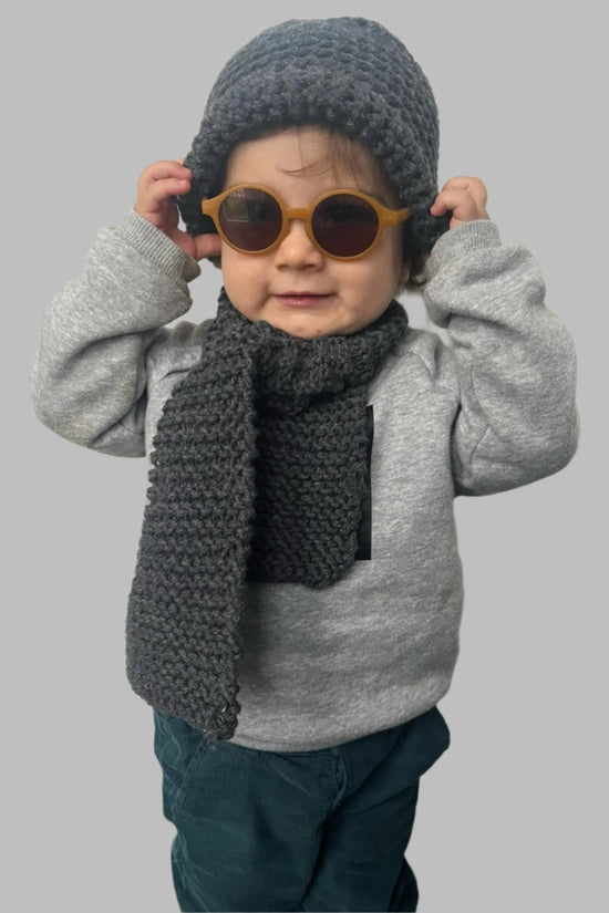 ﻿Zerobarracento Hand-knitted wool scarf for baby Vendita